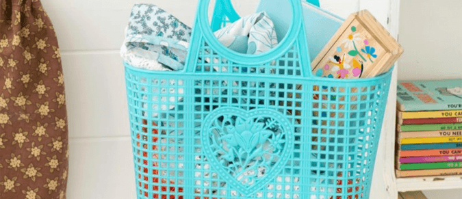 Blue plastic basket filled with toys