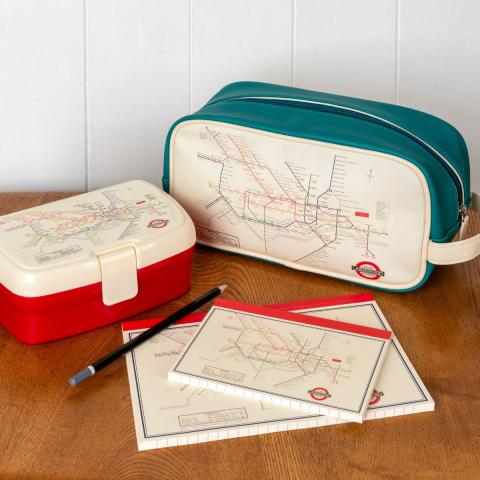 A lunch box, wash bag and notebooks decorated with the London Tube Map