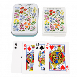 Standard deck of playing cards with print of wild flowers on white background on backs plus metal tin
